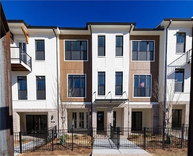 Homesite 28 - Barnsley 2 BR with inviting terrace level entry. Charming fenced front yard welcomes you to the townhome.