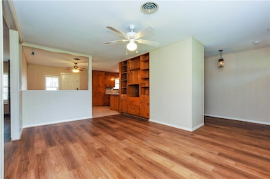 Unfurnished living room featuring hardwood / wood-