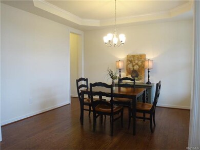 Formal Dining Room with Tray Ceiling and passage w
