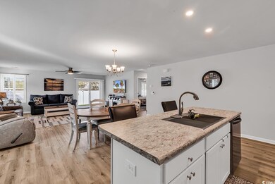 Kitchen featuring light wood finished floors, open