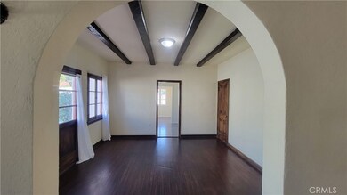 Spacious formal dining room with beamed ceilings