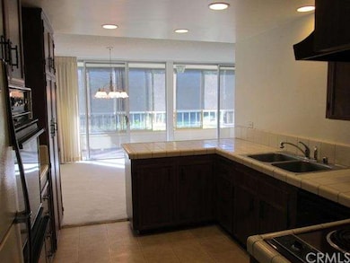 Kitchen looking at dining area and balcony