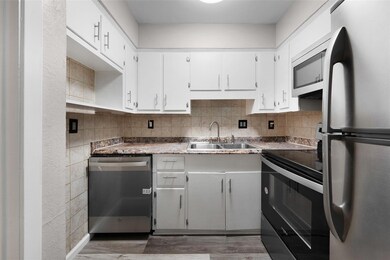 Kitchen with dark hardwood / wood-style flooring, 
