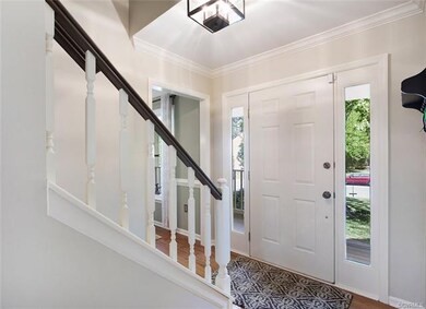 Entryway showing opening to dining room adjacent t
