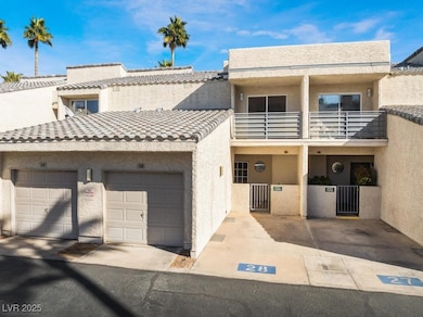Multi unit property featuring a tile roof, stucco