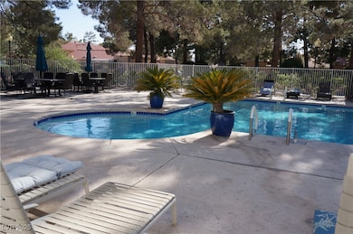 Community pool featuring a patio area