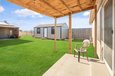 Building to the left is the party house, She shed is to the middle, and the covered porch is the back of the main home.