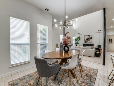 Tiled dining area featuring a healthy amount of su