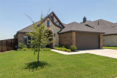 View of front of property featuring a garage and a