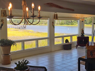 Sunroom / solarium with a wood stove and a wealth 