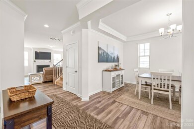 View of living room and fireplace from Foyer