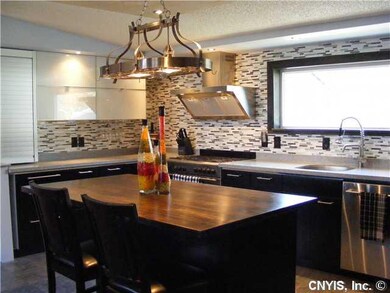 Kitchen. 5 Burner stove.oven and custom tile backs