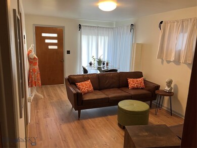 Living room with wood-type flooring