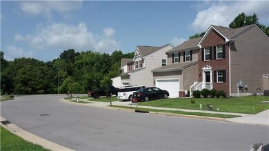Cul-de-sac street, in quiet community surrounded by trees
