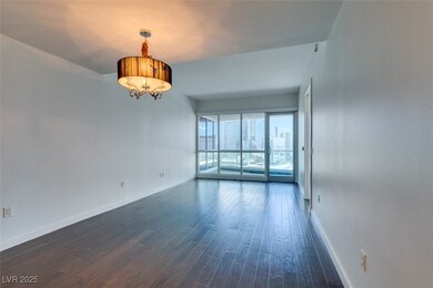 Empty room with baseboards, dark wood finished flo