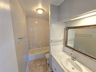 Full bathroom featuring vanity and tub / shower combination