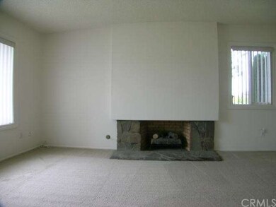 Wood & gas burning fireplace in the living room.