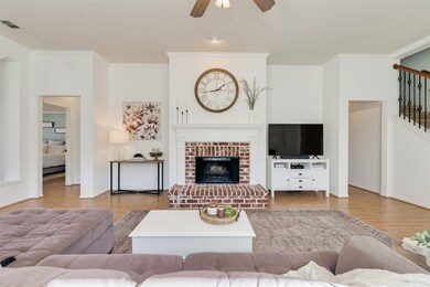 Wood burning fire place, wood floors and calming paint colors.