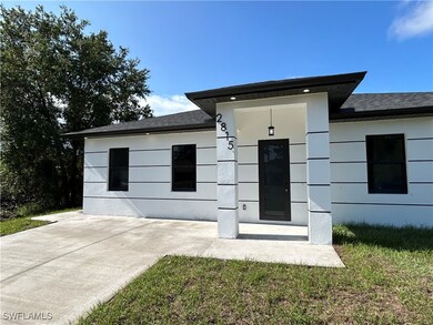 View of front of home with a shingled roof