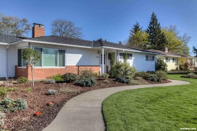 Quaint concrete walkway adds to the curb appeal.