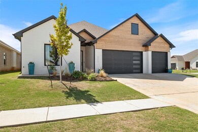 View of front of house featuring a garage and a fr
