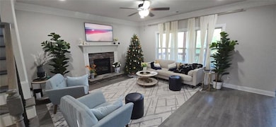 Spare room featuring crown molding, dark wood-style floors, recessed lighting, and baseboards