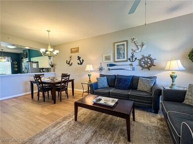 Living room with hardwood / wood-style flooring an