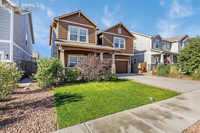 View of front of home featuring concrete driveway, an attached garage, a residential view, and stone siding