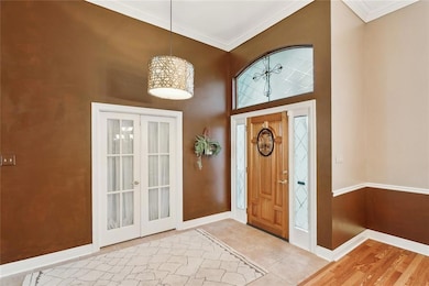 Foyer with french doors to 4th bedroom/office