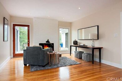 Living room with cozy brick fireplace