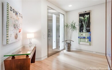 Inviting foyer with wood floors