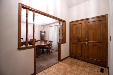 Tiled Entryway & Formal Dining Room