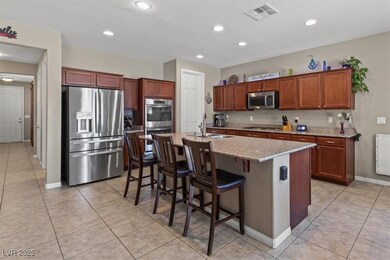 Kitchen with stainless steel appliances, a sink, b