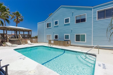 Community pool featuring a gazebo and a patio area