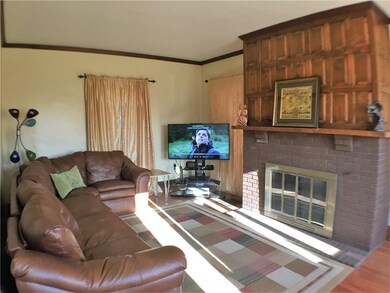 The family room/living room with hard wood floors 