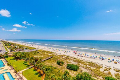 Exterior space featuring a beach view and a water 