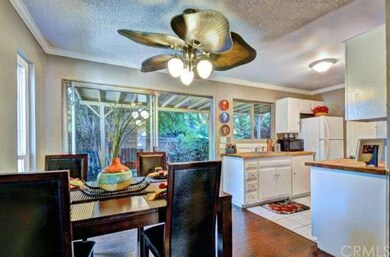 Light and bright dining area with view of lush pat