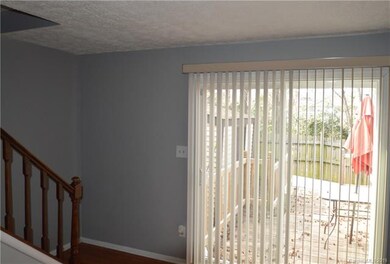 Newly installed sliding glass patio doors lead to 