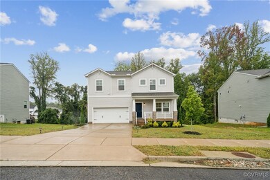 View of front of house featuring a front lawn, cov