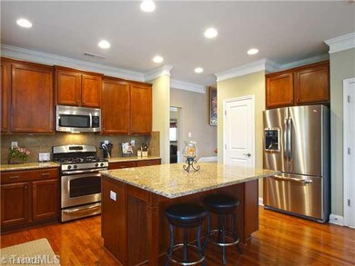 Kitchen. GE stainless steel appliances include the four-burner gas range, a built-in microwave and dishwasher.