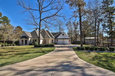 LONG DRIVEWAY WITH EXTRA PARKING AREA ADDED CLOSE TO GARAGE