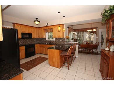 Alternate view of kitchen, looking at eat in area 