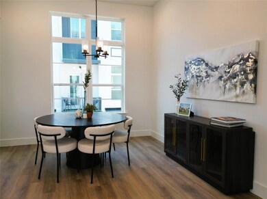 Dining room with a chandelier and hardwood / wood-