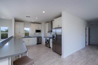 Open kitchen with bar seating