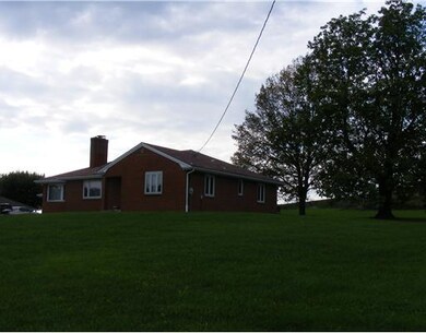 Exterior Front. Beautiful 1.5 acre lot.