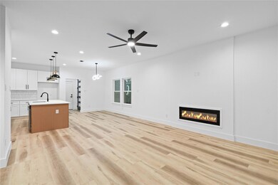 Unfurnished living room featuring a glass covered 