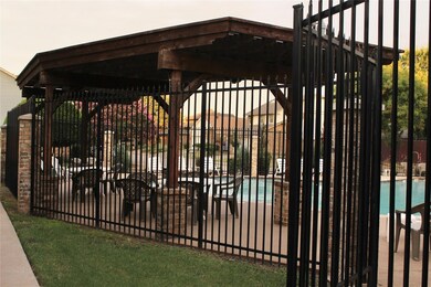 View of gate with a community pool