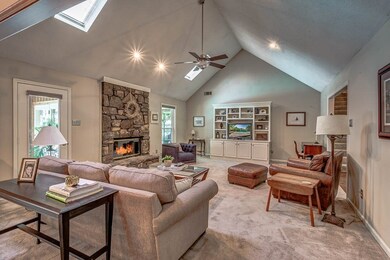Large, Vaulted Great room with Feature Stone surro