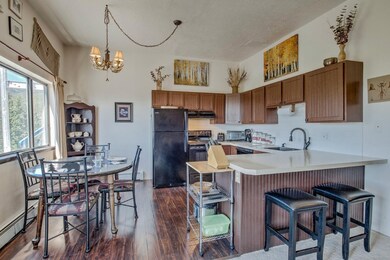 Kitchen with black appliances, under cabinet range