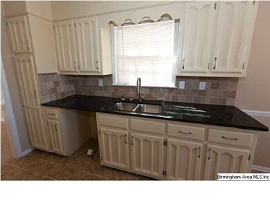 Kitchen features Granite Countertops, Tile Backspl